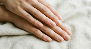 Close up of clean and healthy fingernails after learning how to cut fingernails properly.